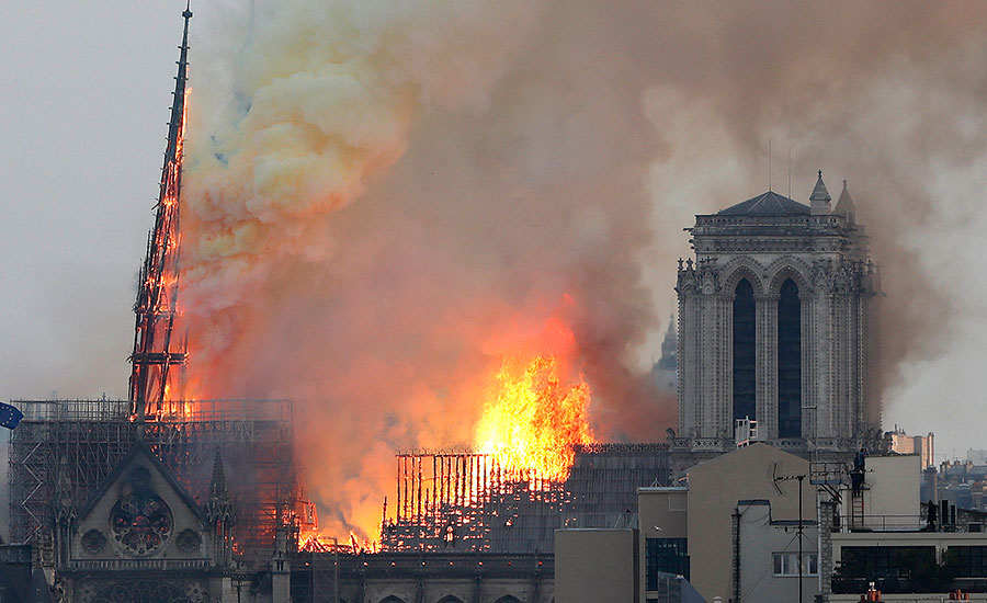 Notre-Dame fire under control, Macron vows to rebuild