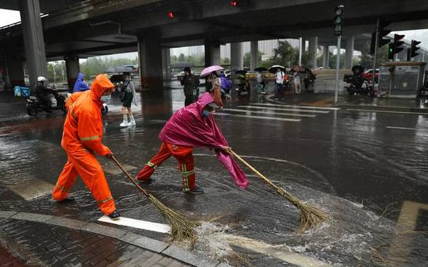 Flights cancelled and schools closed as Beijing hit by storm