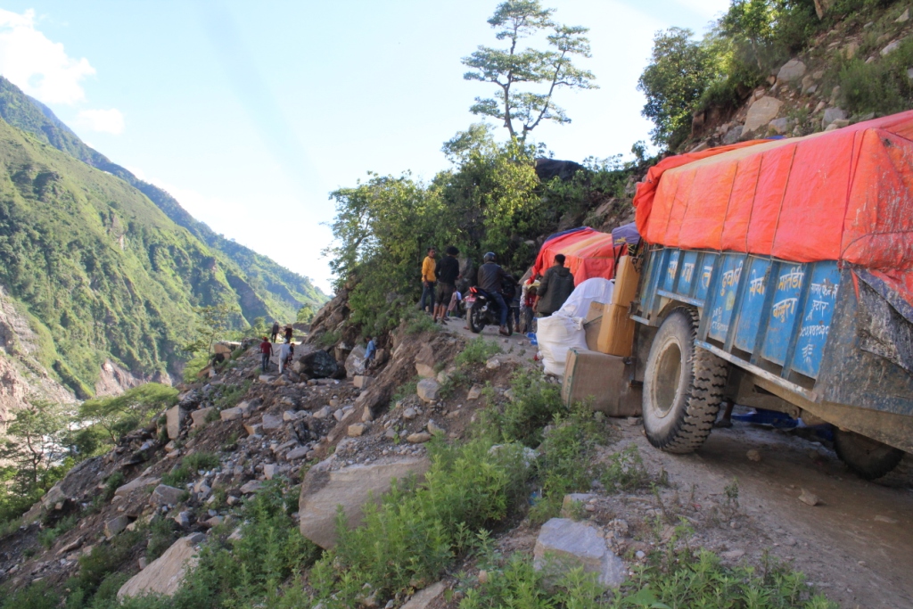 Relief materials stuck due to road obstruction