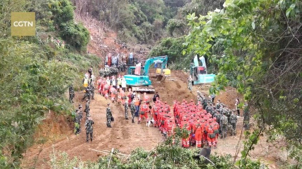 China plane crash: Human remains found amid wreckage