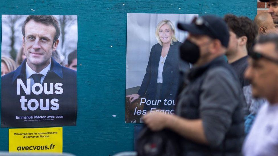 French vote as Macron aims to beat far-right Le Pen