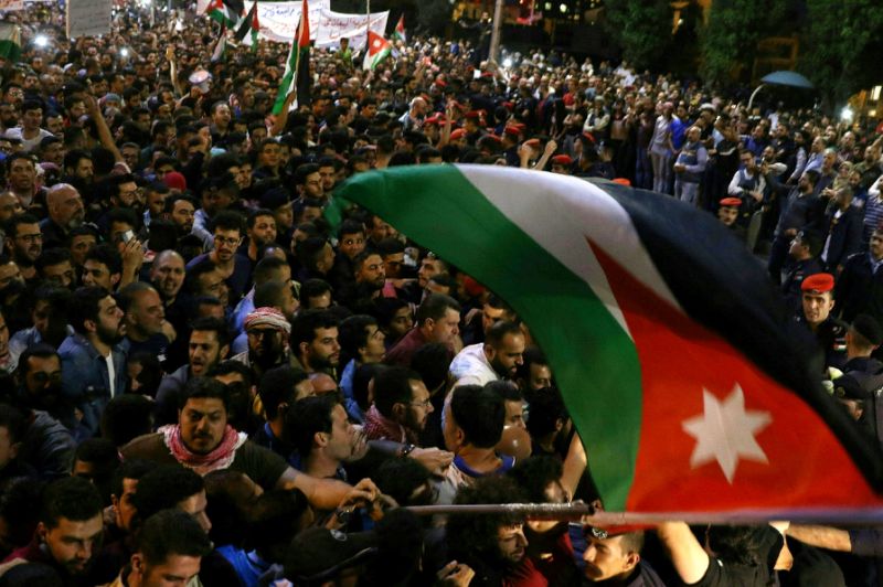 Jordan king calls for review of bill that sparked protests