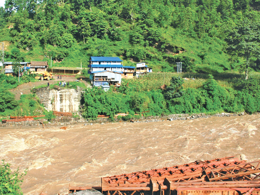 Flood sweeps away two bridges in Olangchungola