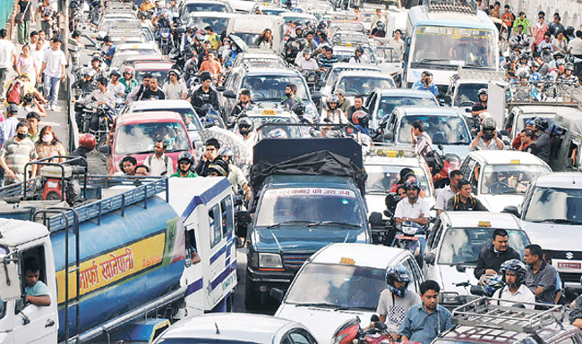 Traffic jam held demanding restoration of damaged roads