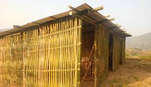 Flood survivors under bamboo huts