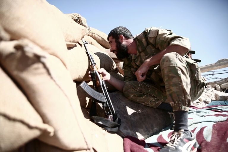Syria rebels and jihadists clash, killing 19