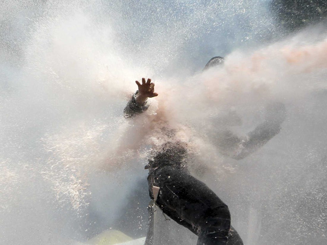 Protesters brought under control using water cannon