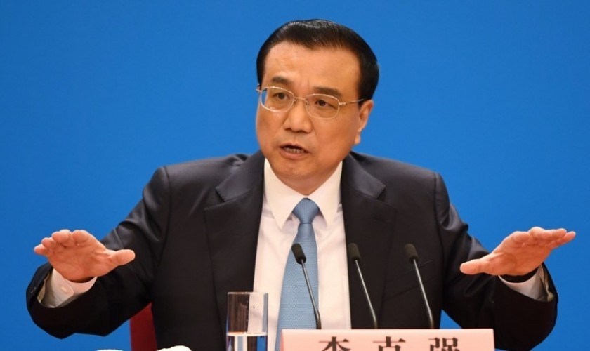 China's premier denies Beijing tells companies to spy