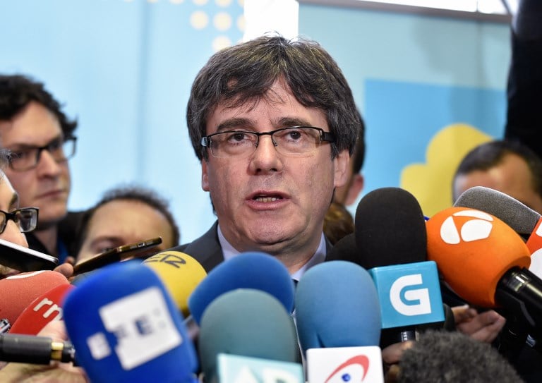 Court ruling pressures fugitive Catalan leader to return to Spain