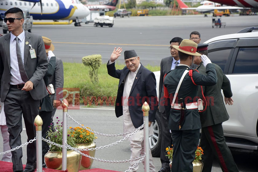 PM Oli returns home after medical treatment