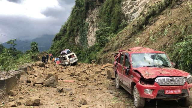 Driver buried in landslide dies