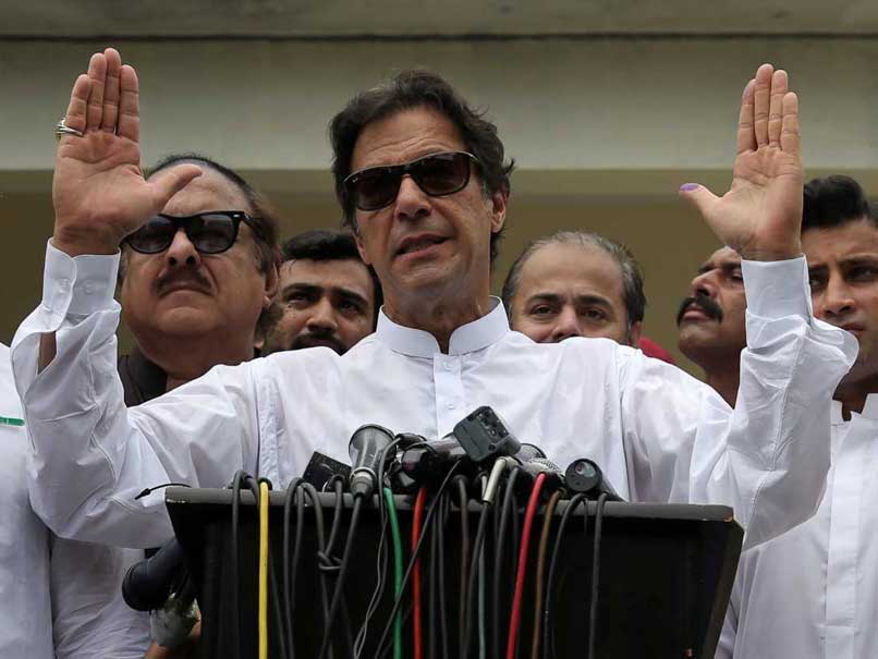 Imran Khan's party begins coalition talks as rivals plan protests