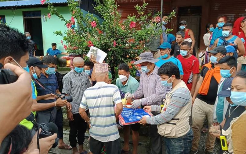 Nepali Congress provides relief materials to Bhotekoshi flood-hit people