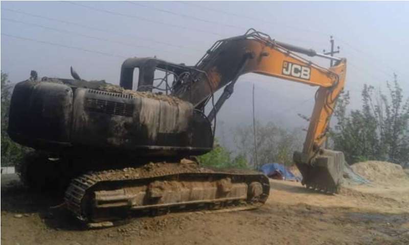 Unidentified group torches excavator