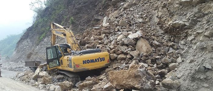 Landslide buries excavator driver along with vehicle