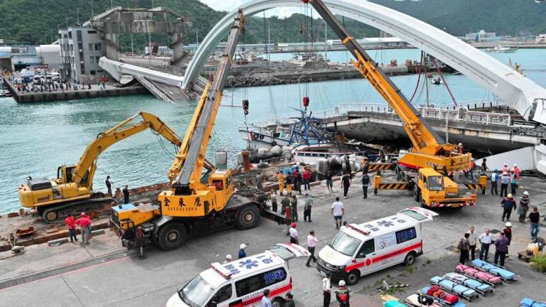 Rescuers fear six trapped after Taiwan bridge collapse