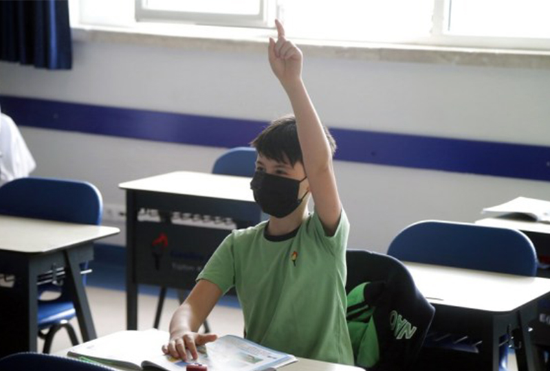 Mideast in Pictures: Back to school, with face masks