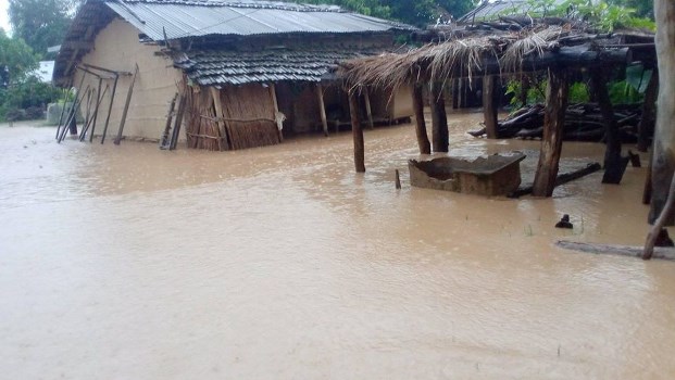 Flood flows through human settlements; four went missing